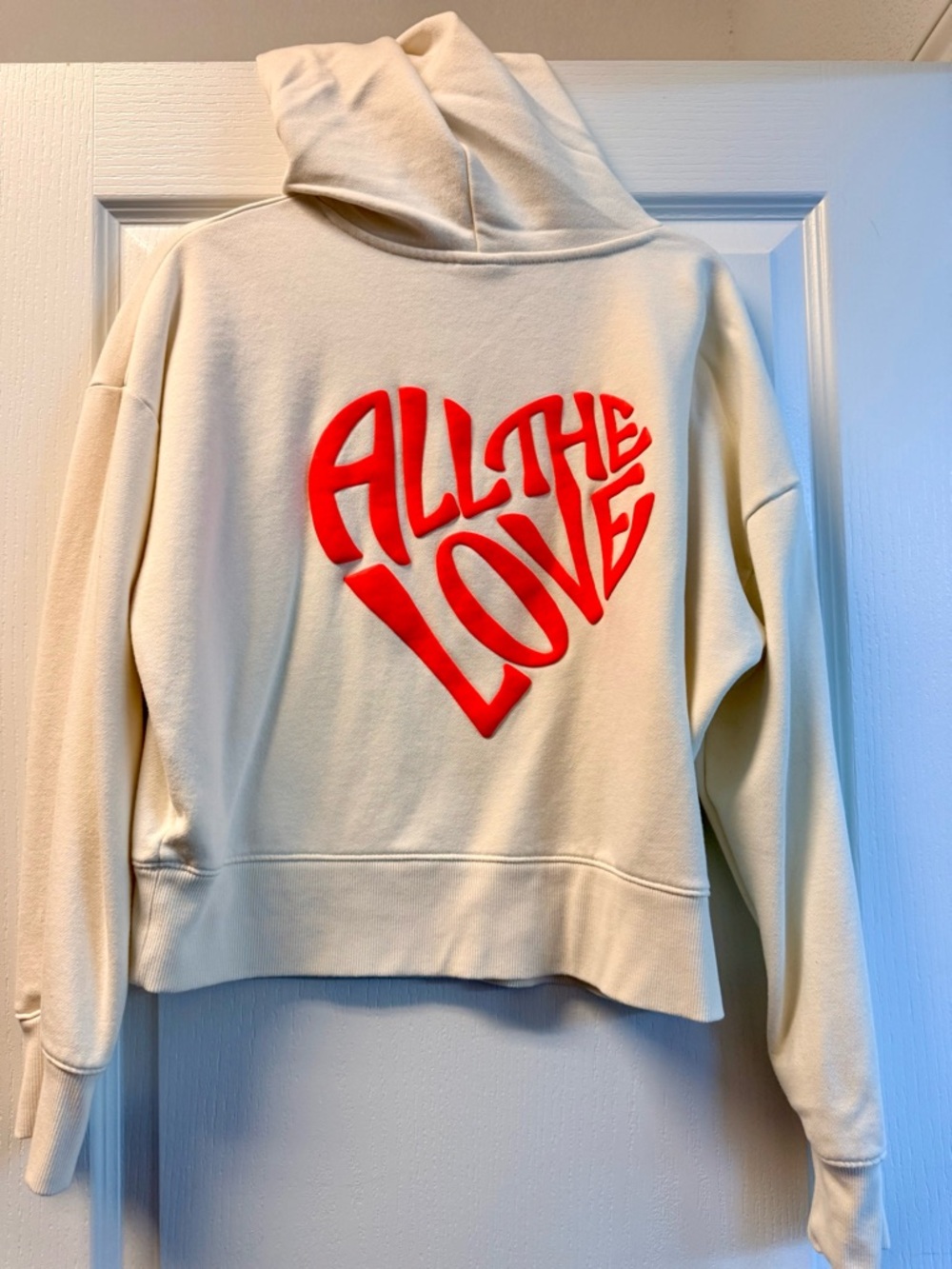 a new day Cream Hoodie with Red "All The Love" Heart Graphic